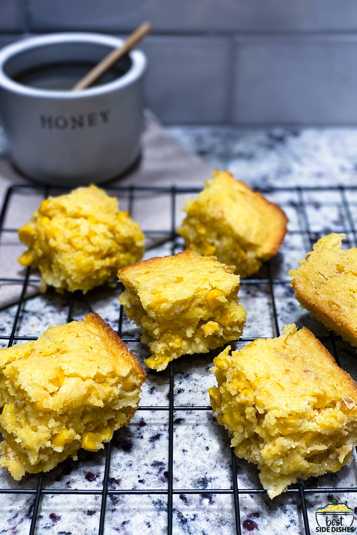 Slices of corn casserole on a baking rack