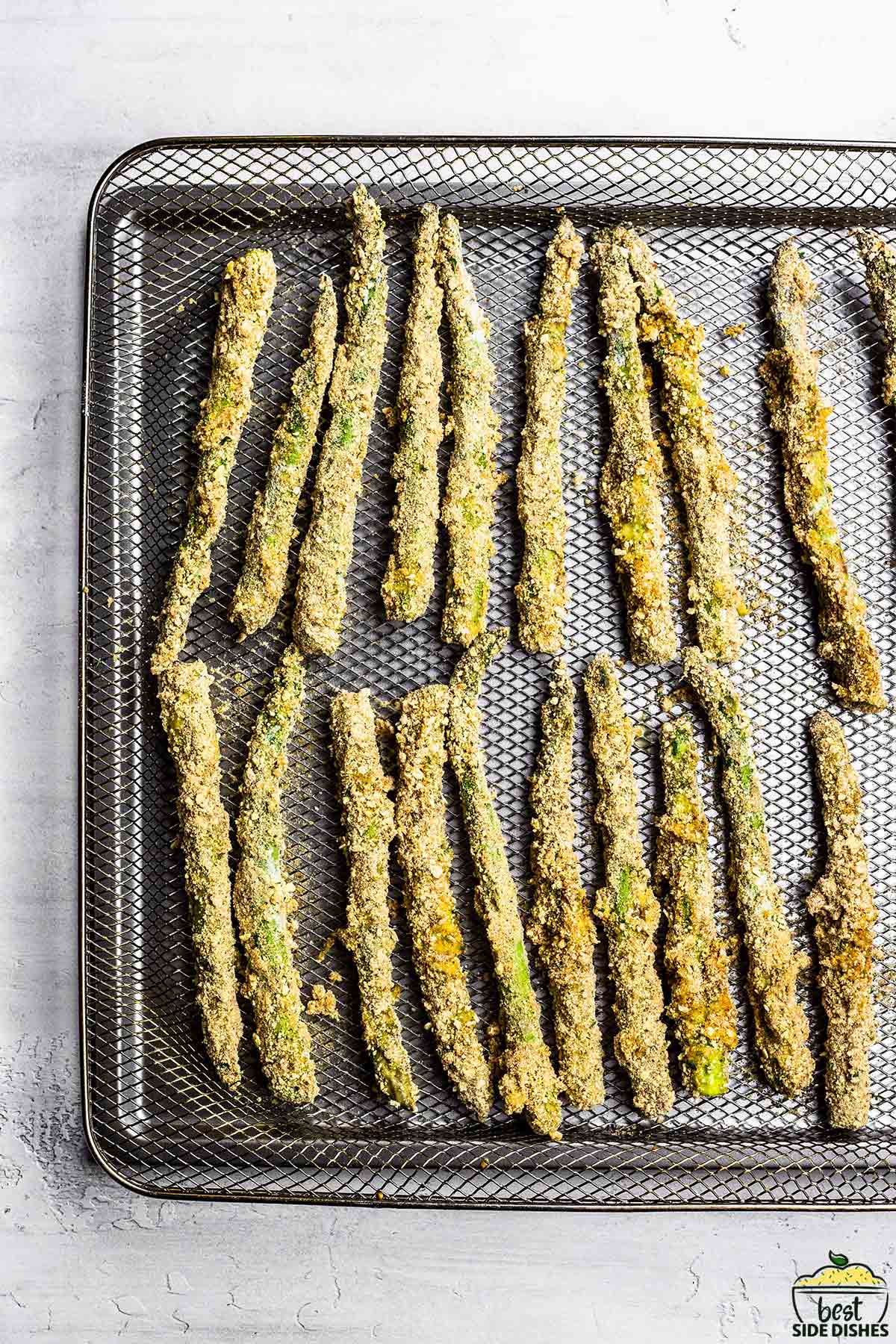 asparagus fries on an air fryer tray
