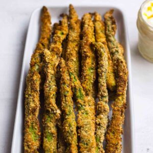 asparagus fries on a white platter