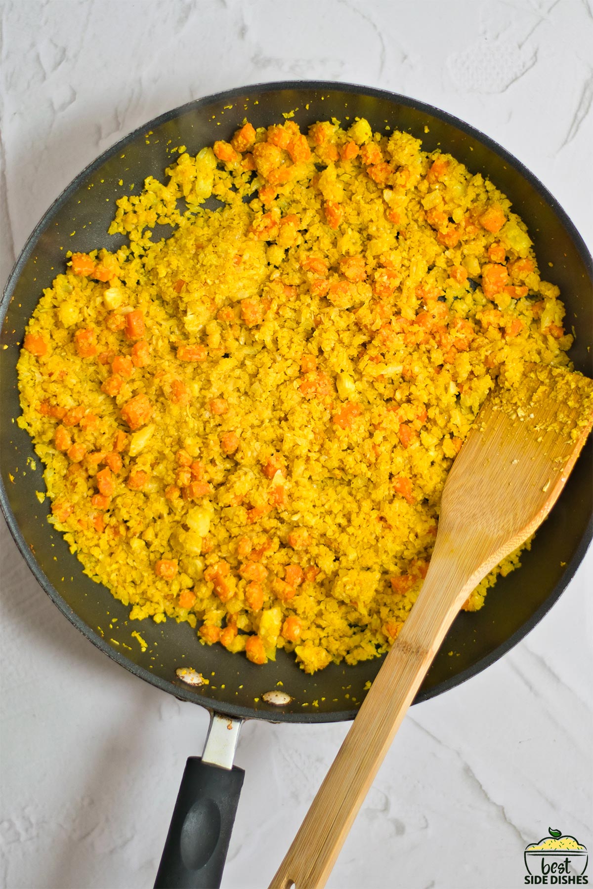Completed turmeric cauliflower rice in a pan