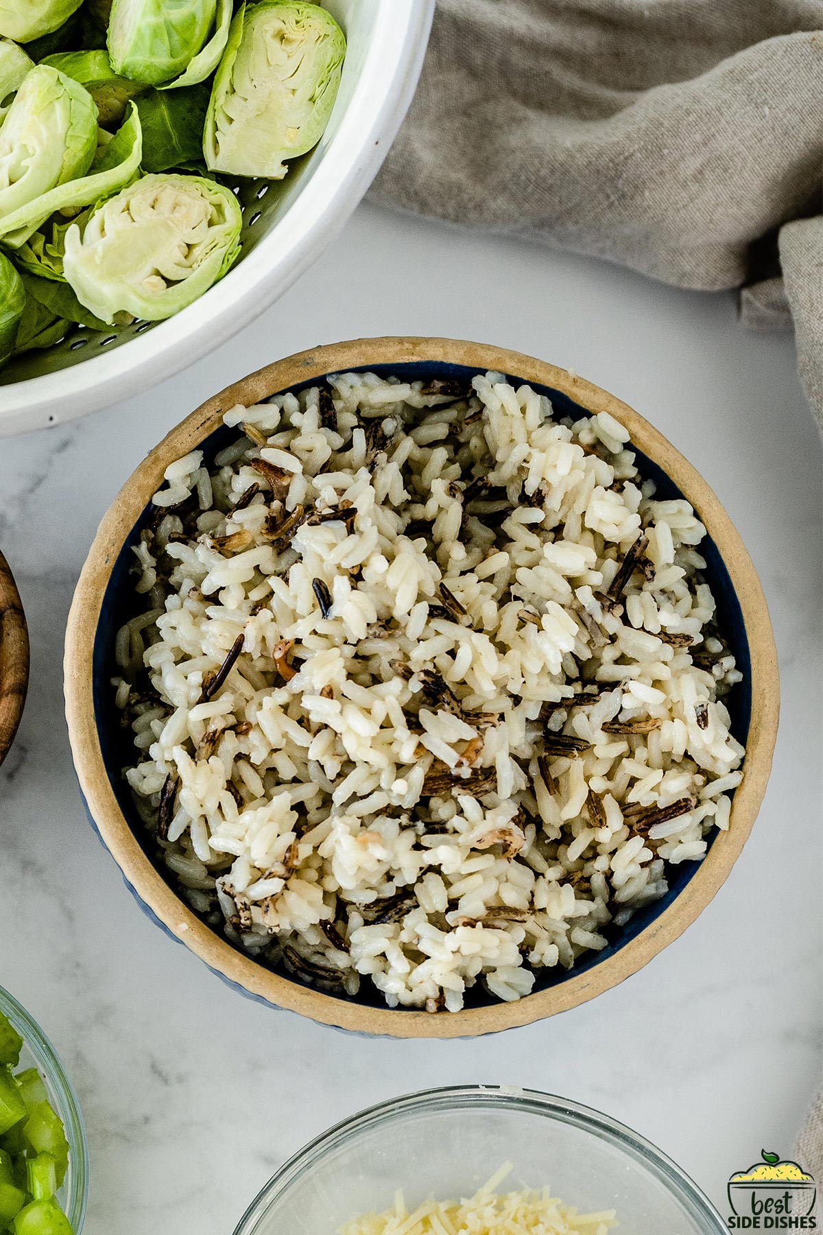 cooked wild rice in a wooden bowl