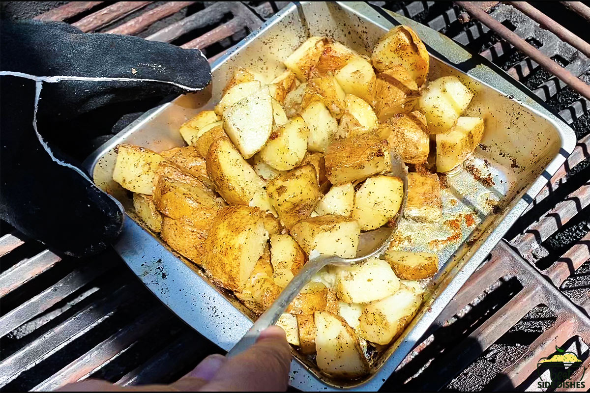 Potatoes on the grill in a baking dish