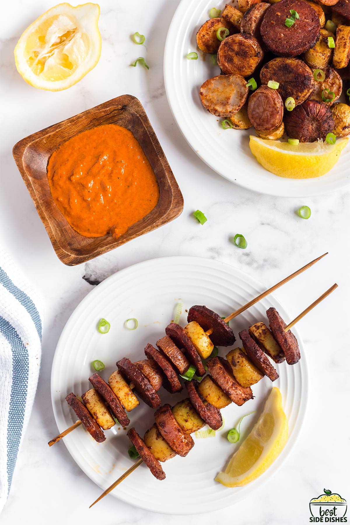 papas con chorizo on skewers on a plate