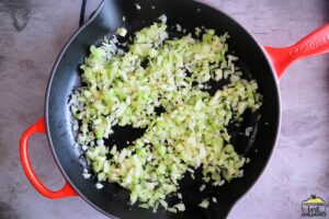 cooking celery and onions in a pan