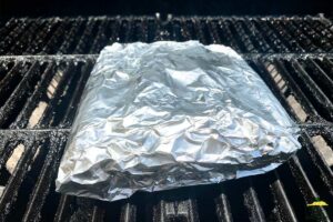 foil-wrapped corn on the grill