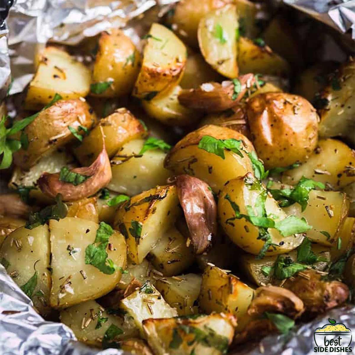 Grilled potatoes with parsley in foil