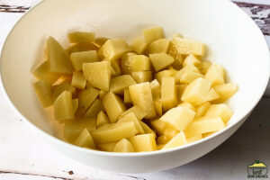 potatoes diced in a white bowl