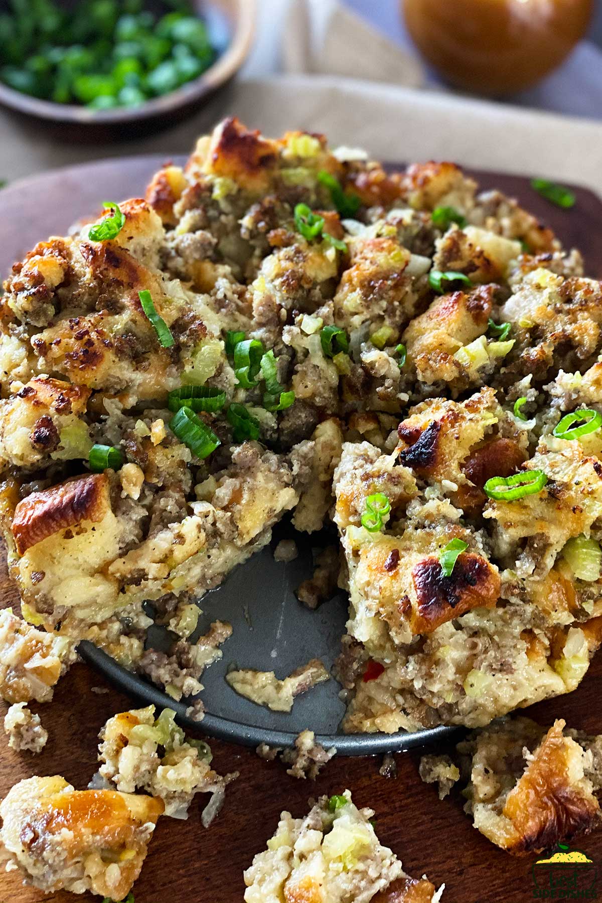 instant pot stuffing on a wood cutting board with a slice missing