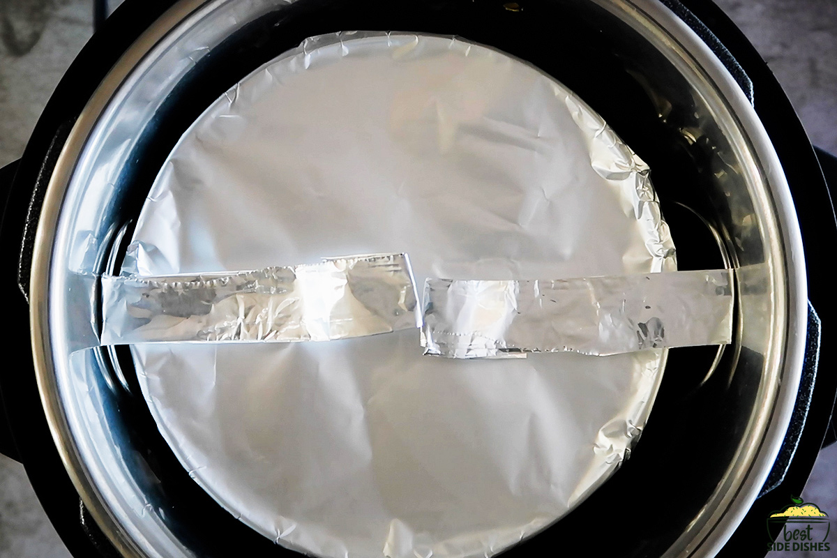 Aluminum foil wrapped pan in the instant pot with a foil sling