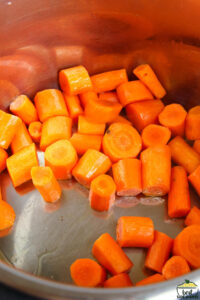 carrots being sauteed in an instant pot