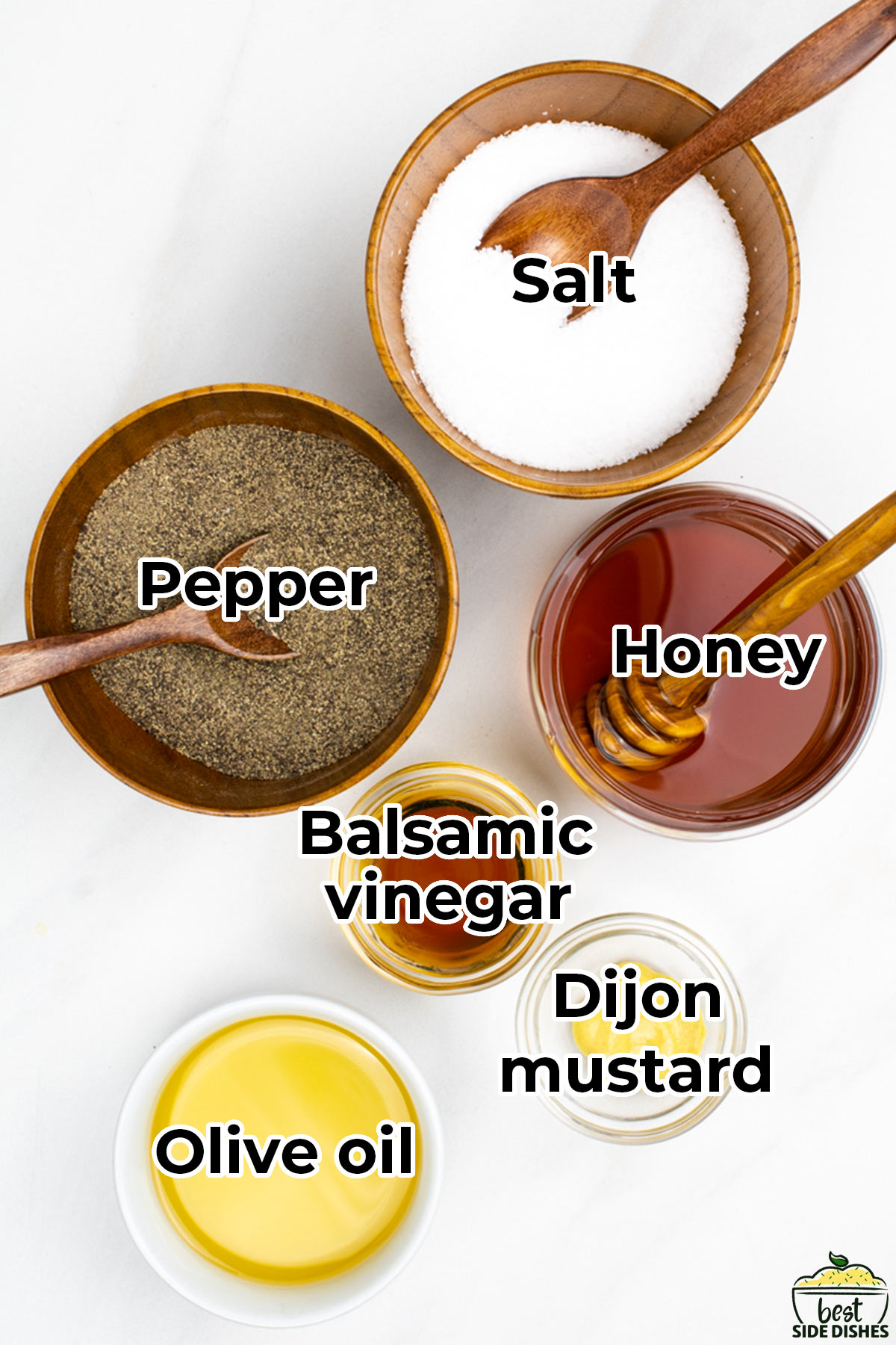 the ingredients for vinaigrette in separate bowls with labels