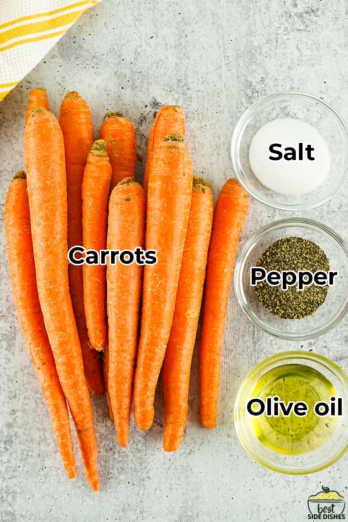 carrots, salt, pepper and oil in separate bowls on a granite table with labels