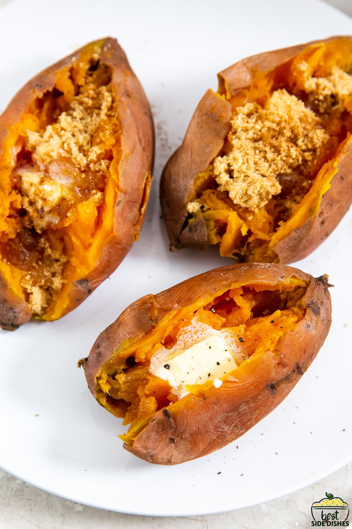 a plate with four sweet potatoes with different fillings in each one: one with butter, one with brown sugar and one with brown sugar and cinnamon