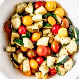 cucumber feta salad up close with cherry tomatoes in a bowl