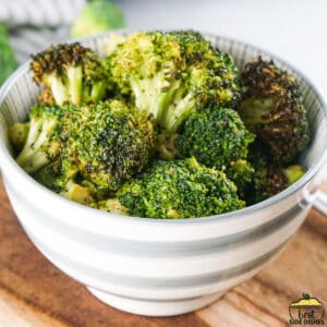 Air fried broccoli in a white bowl