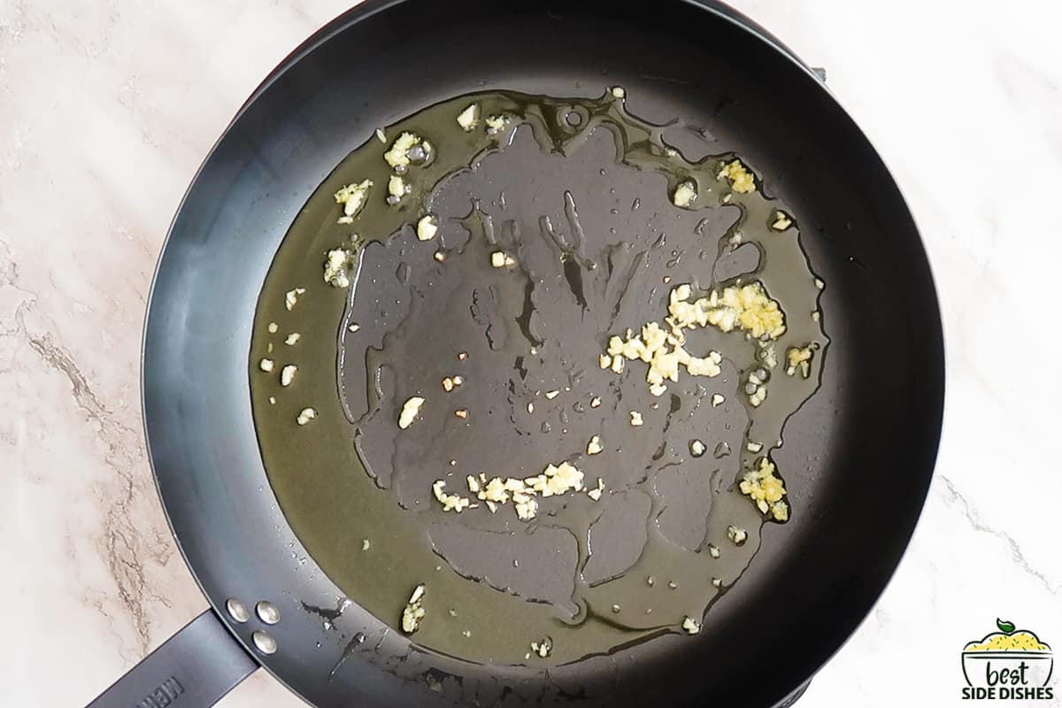 oil and minced garlic on a skillet