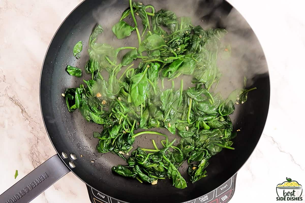 sautéed spinach in a skillet
