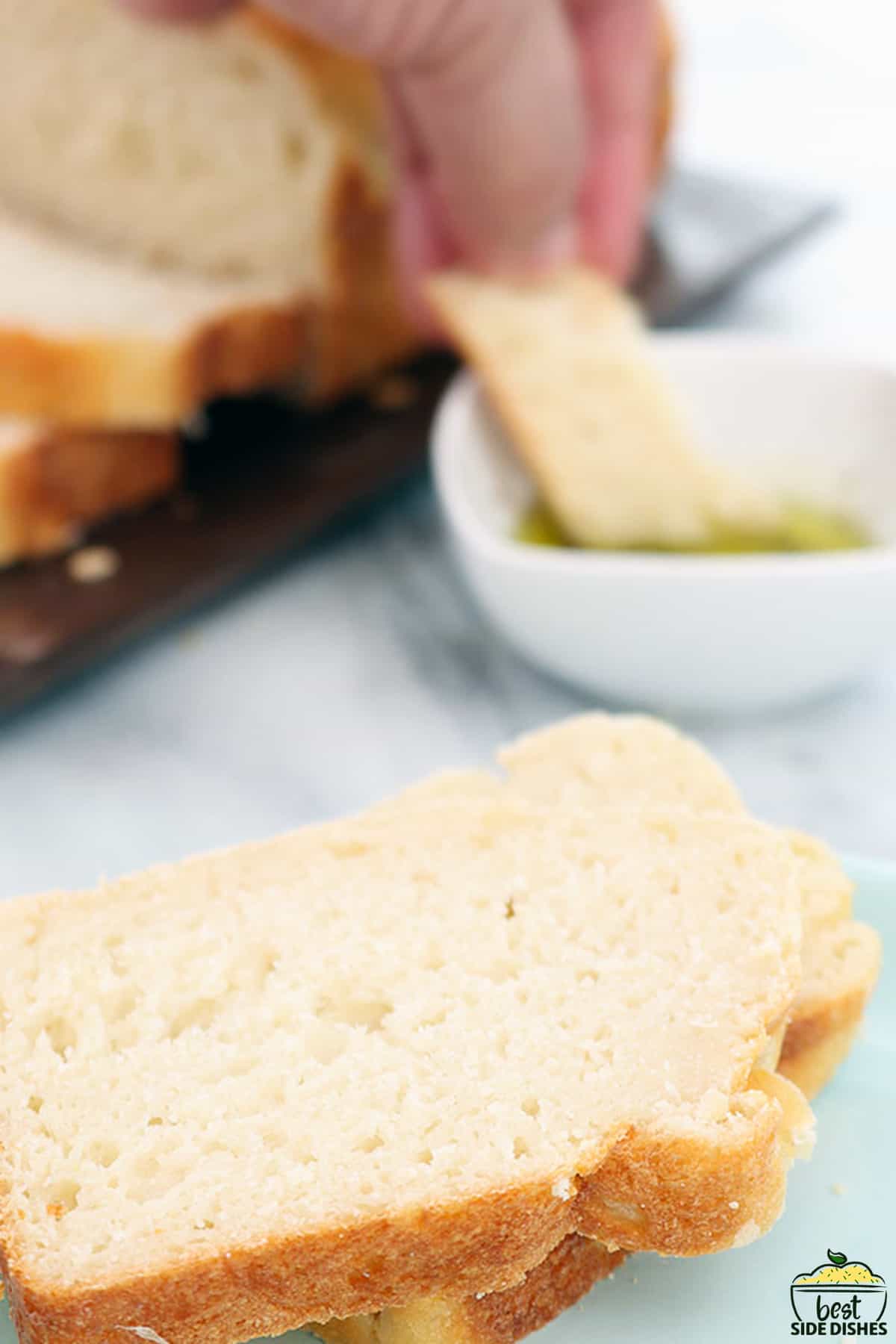 slow cooker bread slices dipping into oil