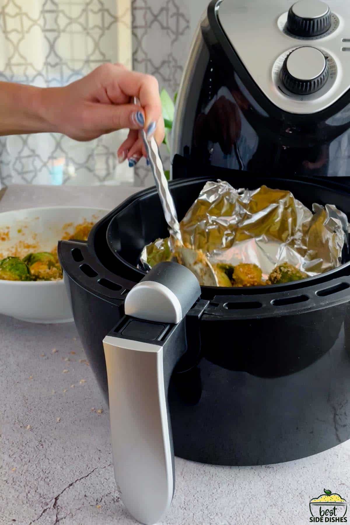 adding brussels sprouts to the air fryer