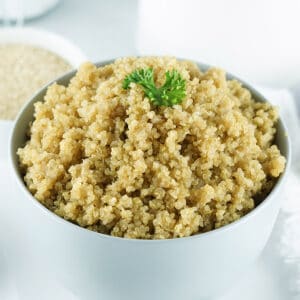 a white bowl of instant pot quinoa fully cooked
