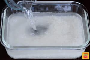 rice and water in a microwave safe container