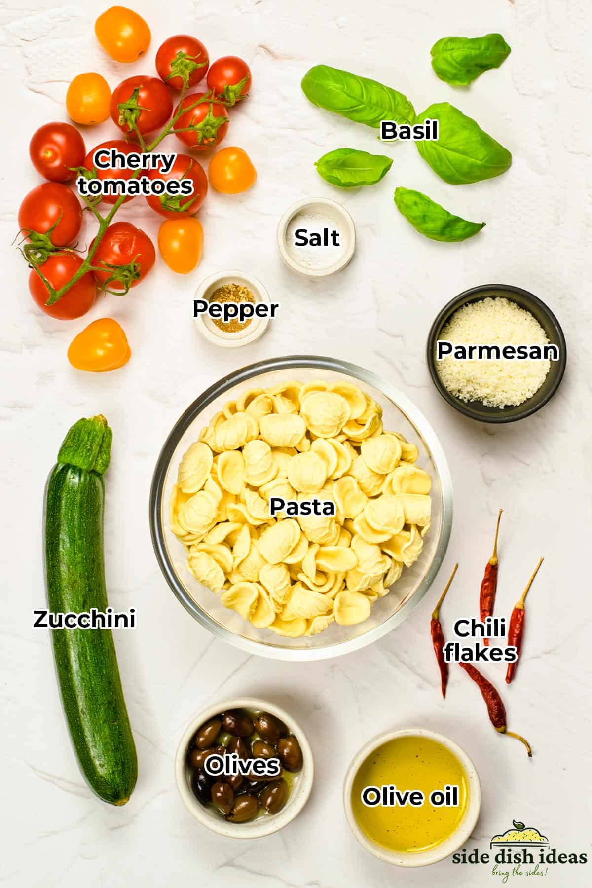 all the ingredients for summer pasta in separate bowls with labels