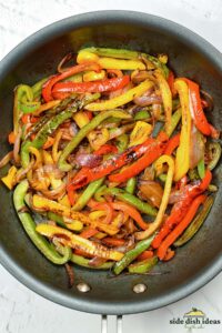 fajita veggies cooked and lightly charred in a skillet