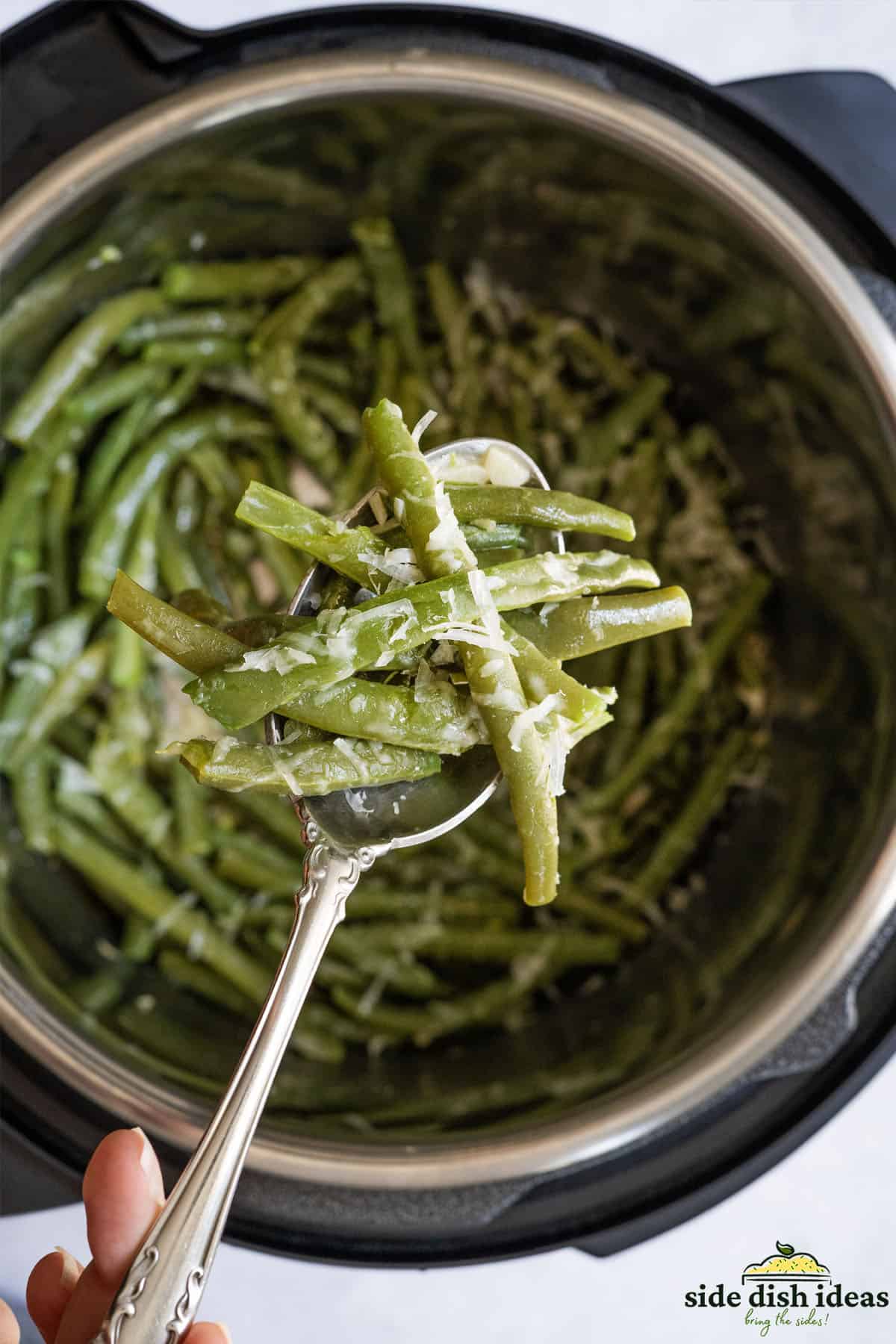 instant pot green beans on a spoon