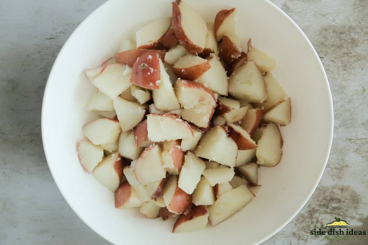 potatoes for potato salad drained in a bowl