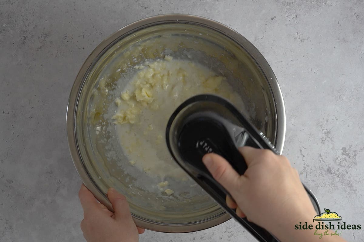 mixing pineapple ingredients together in a mixing bowl