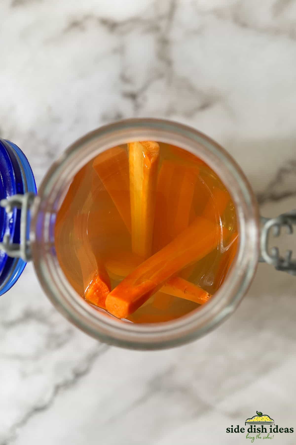 pickled carrots inside a glass jar