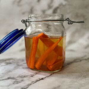 pickled carrots inside of a glass jar