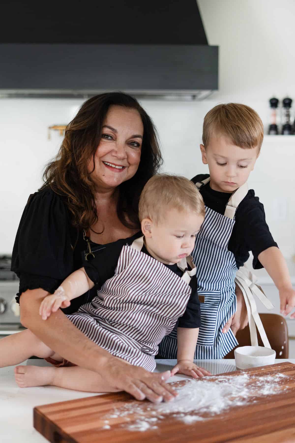 Isabel cooking with her grandchildren
